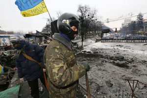 Anti-government protesters stand along barricades in Kiev, Ukraine. (Sergei L. Loiko / Los Angeles Times / January 28, 2014) http://www.latimes.com/world/worldnow/la-fg-wn-ukraine-protests-premier-resigns-20140128,0,2753657.story#ixzz2rnoBVJoI